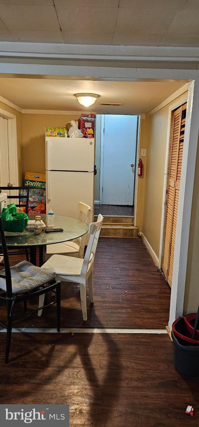 dining room with hardwood / wood-style flooring