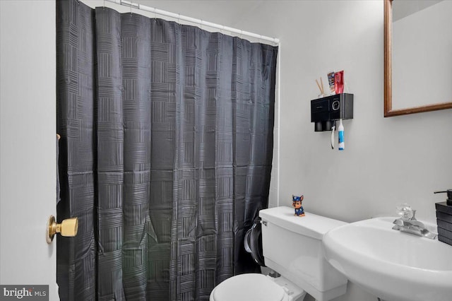 bathroom with toilet and sink