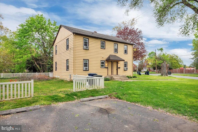 view of front of home with a front lawn