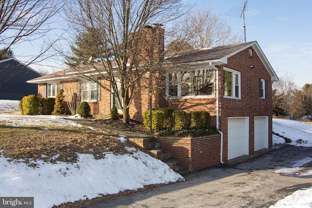 view of front of home with a garage