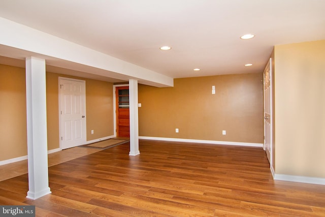 basement featuring hardwood / wood-style floors