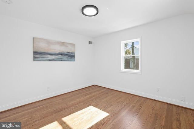 spare room featuring light hardwood / wood-style flooring