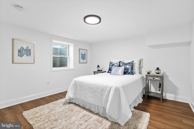 bedroom featuring dark hardwood / wood-style floors