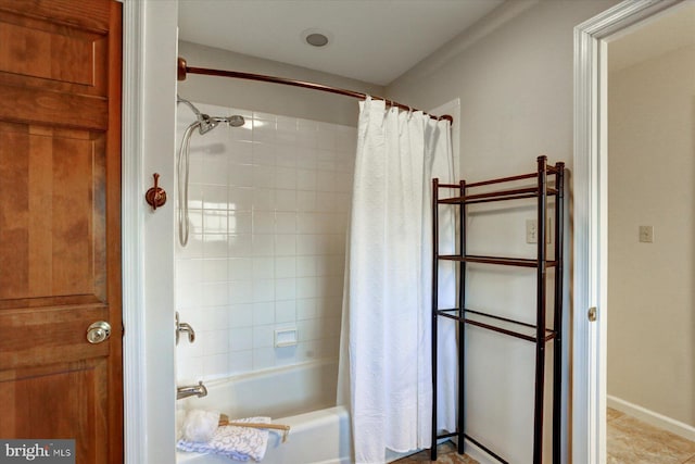 bathroom featuring shower / bathtub combination with curtain