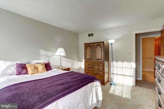 bedroom with light colored carpet