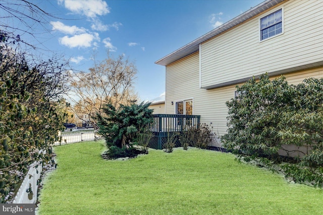 view of yard with a wooden deck