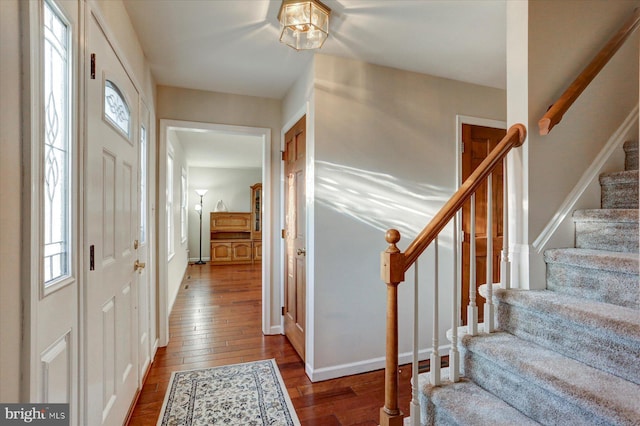 entryway with hardwood / wood-style floors