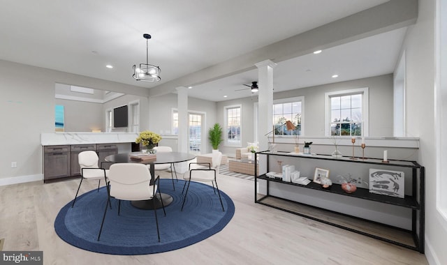81 Filly Ln, Lewes, DE 19958 - dining space with ornate columns, light wood finished floors, plenty of natural light, baseboards, and recessed lighting