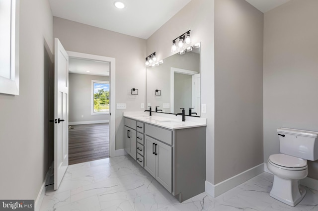 81 Filly Ln, Lewes, DE 19958 - bathroom featuring marble finish flooring, baseboards, toilet, double vanity, and recessed lighting