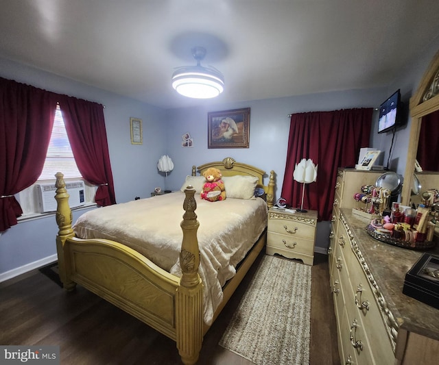 bedroom featuring dark hardwood / wood-style flooring and cooling unit