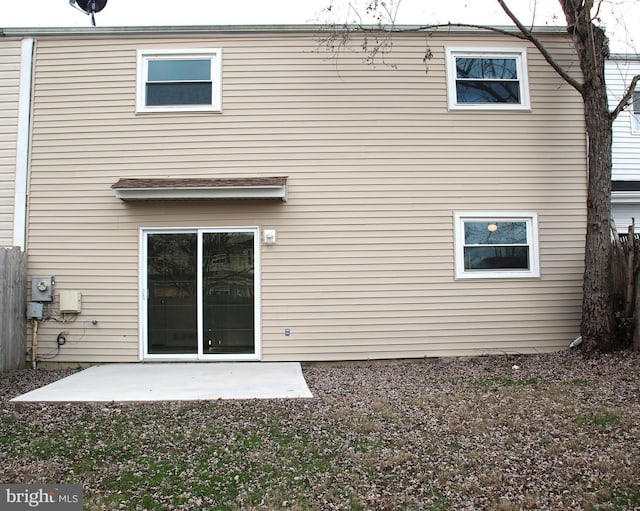 back of property with a patio area