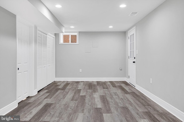 basement featuring wood-type flooring