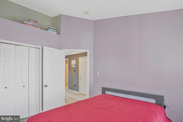 carpeted bedroom with a closet