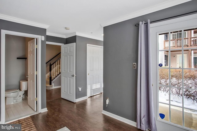 interior space featuring dark hardwood / wood-style floors and ornamental molding