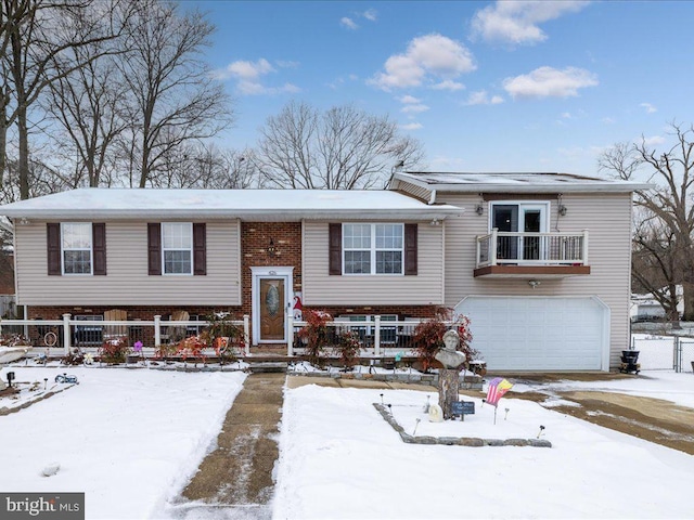 split foyer home with a balcony and a garage