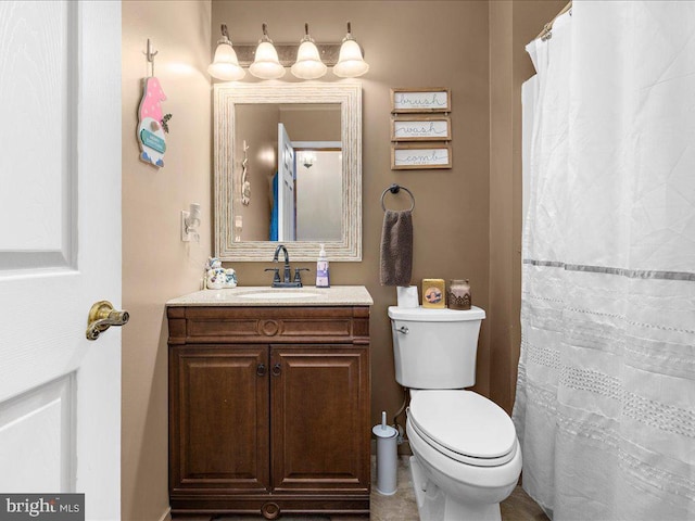 bathroom with toilet and vanity