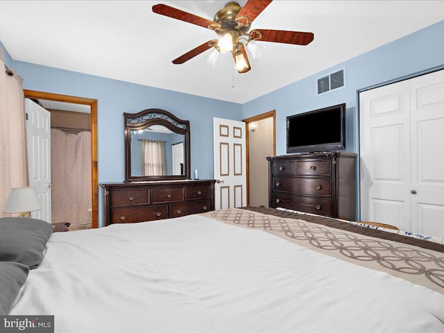 bedroom featuring ceiling fan and a closet