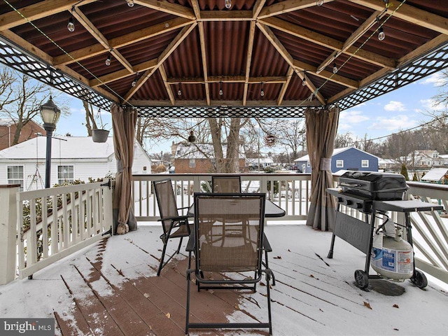 snow covered deck featuring a gazebo