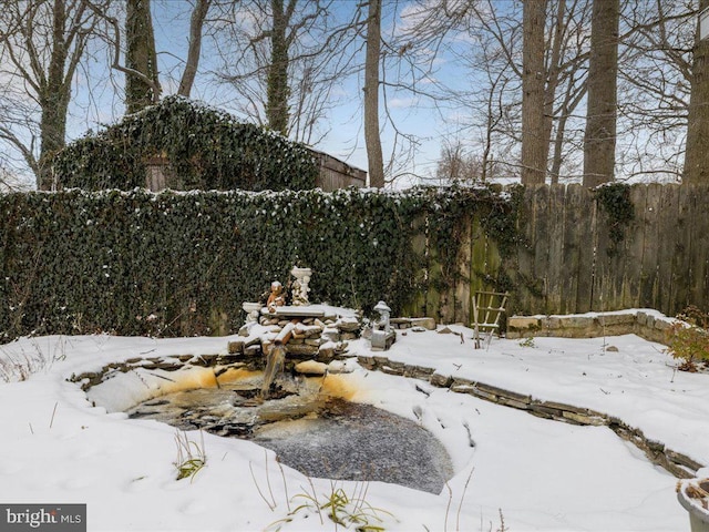 view of yard layered in snow