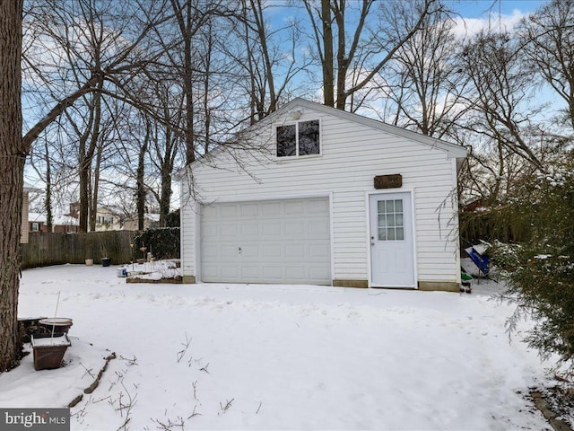 view of snow covered garage