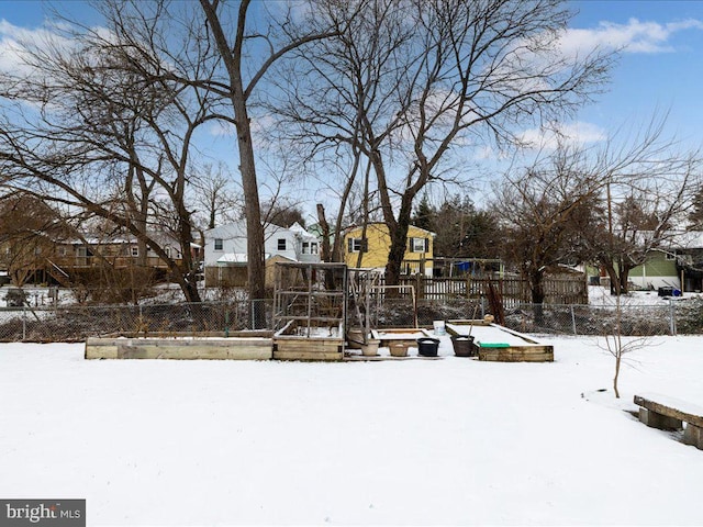 yard layered in snow with a playground