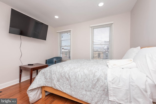 bedroom with hardwood / wood-style flooring