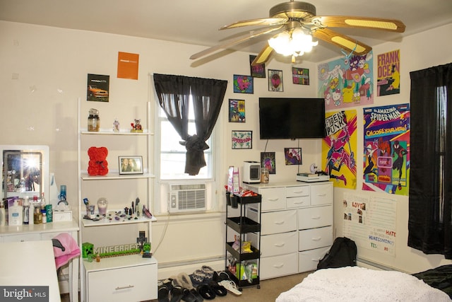 bedroom with ceiling fan, cooling unit, and a baseboard heating unit