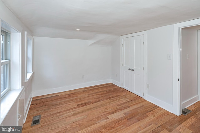 spare room featuring light hardwood / wood-style floors