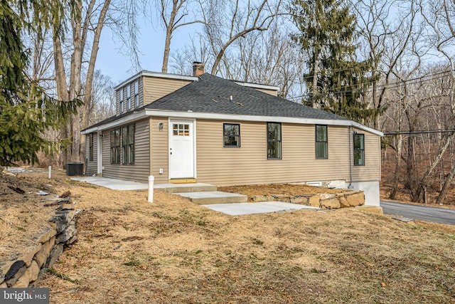 view of front of home featuring a patio and central AC unit