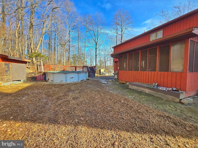 view of side of home featuring a sunroom