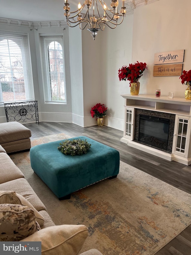 living room featuring a chandelier and dark wood-type flooring