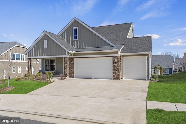 view of front of property featuring covered porch, a garage, and a front lawn