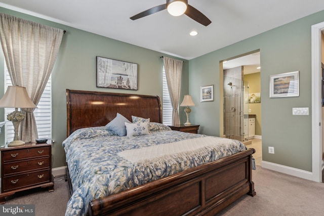 carpeted bedroom featuring ensuite bathroom and ceiling fan