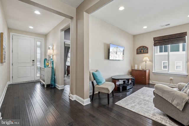 foyer entrance with dark hardwood / wood-style floors