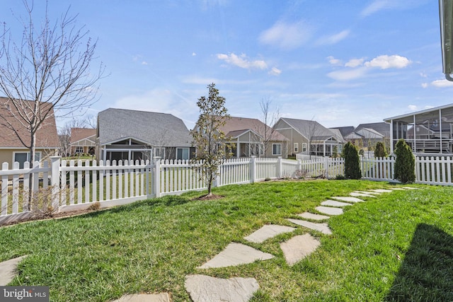 view of yard featuring a sunroom