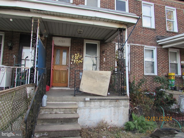 entrance to property with a porch