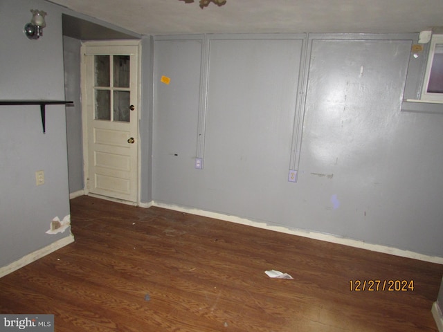 empty room with dark hardwood / wood-style floors