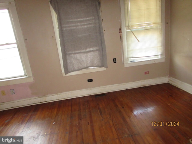 spare room featuring dark hardwood / wood-style flooring