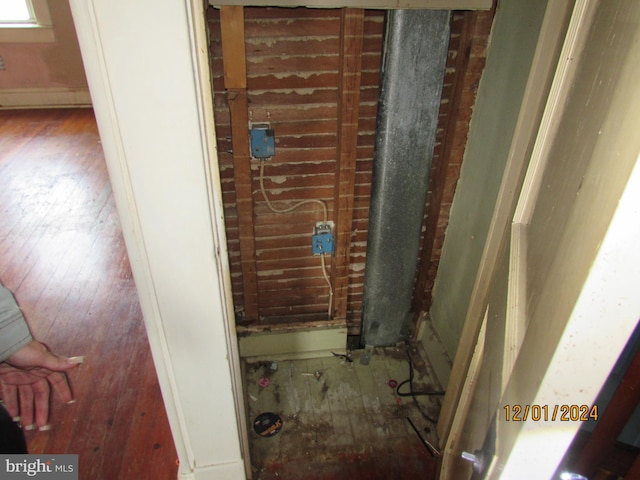 bathroom with hardwood / wood-style floors