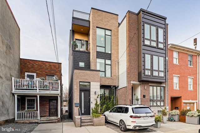 view of front of home featuring brick siding