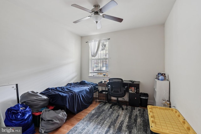 bedroom featuring dark wood-type flooring and ceiling fan