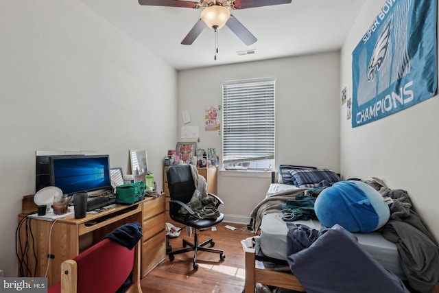 home office featuring hardwood / wood-style flooring and ceiling fan