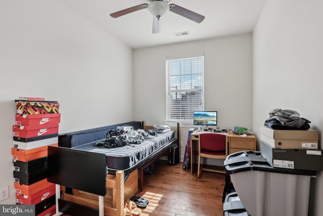 bedroom featuring hardwood / wood-style floors and ceiling fan