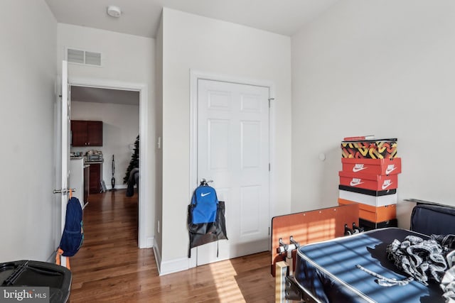 bedroom with wood-type flooring