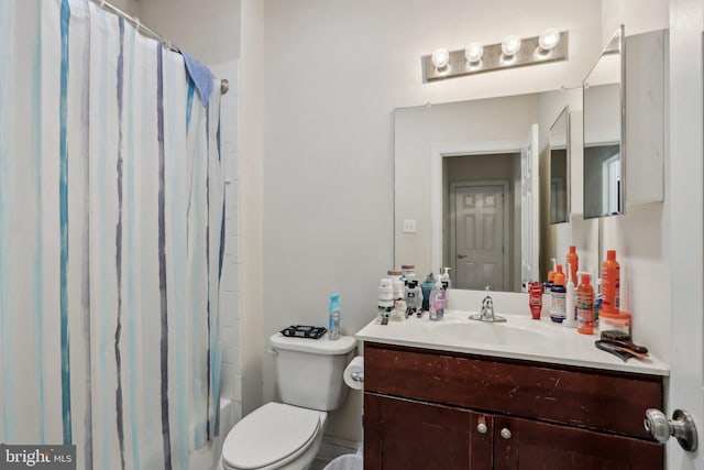 full bathroom featuring vanity, toilet, and shower / tub combo