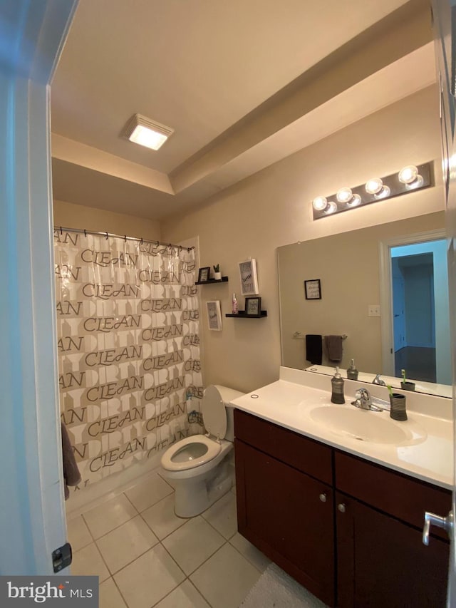 bathroom with vanity, tile patterned floors, and toilet