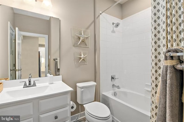 full bathroom featuring vanity, shower / bathtub combination with curtain, and toilet