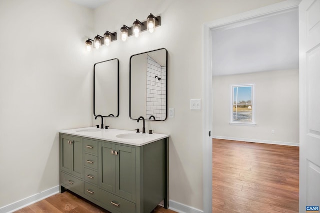 bathroom with vanity and hardwood / wood-style flooring