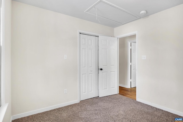 unfurnished bedroom with a closet and carpet flooring