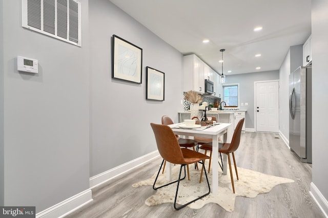 dining area featuring light hardwood / wood-style floors